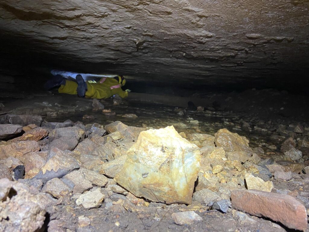 Becky Nelson going over the dam just inside Geronimo Cave.