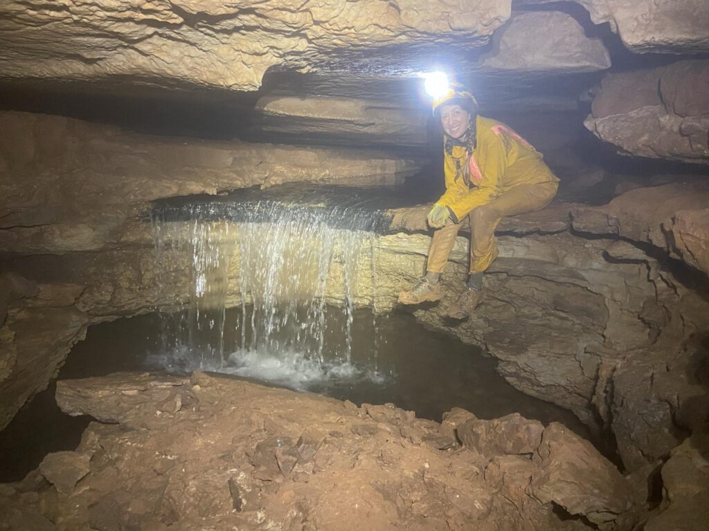 Becky Nelson at the waterfall in Geronimo Cave.